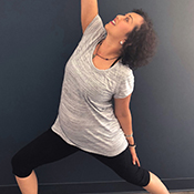 Yoga trainer Sacha demonstrates posture